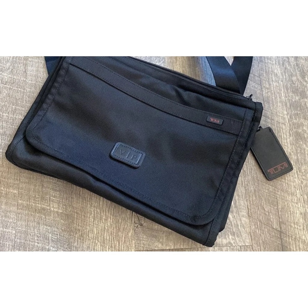 Tumi messenger bag.